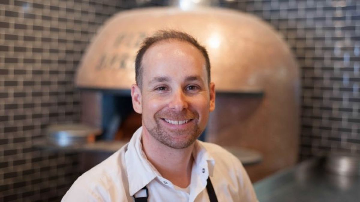 a man smiling for the camera