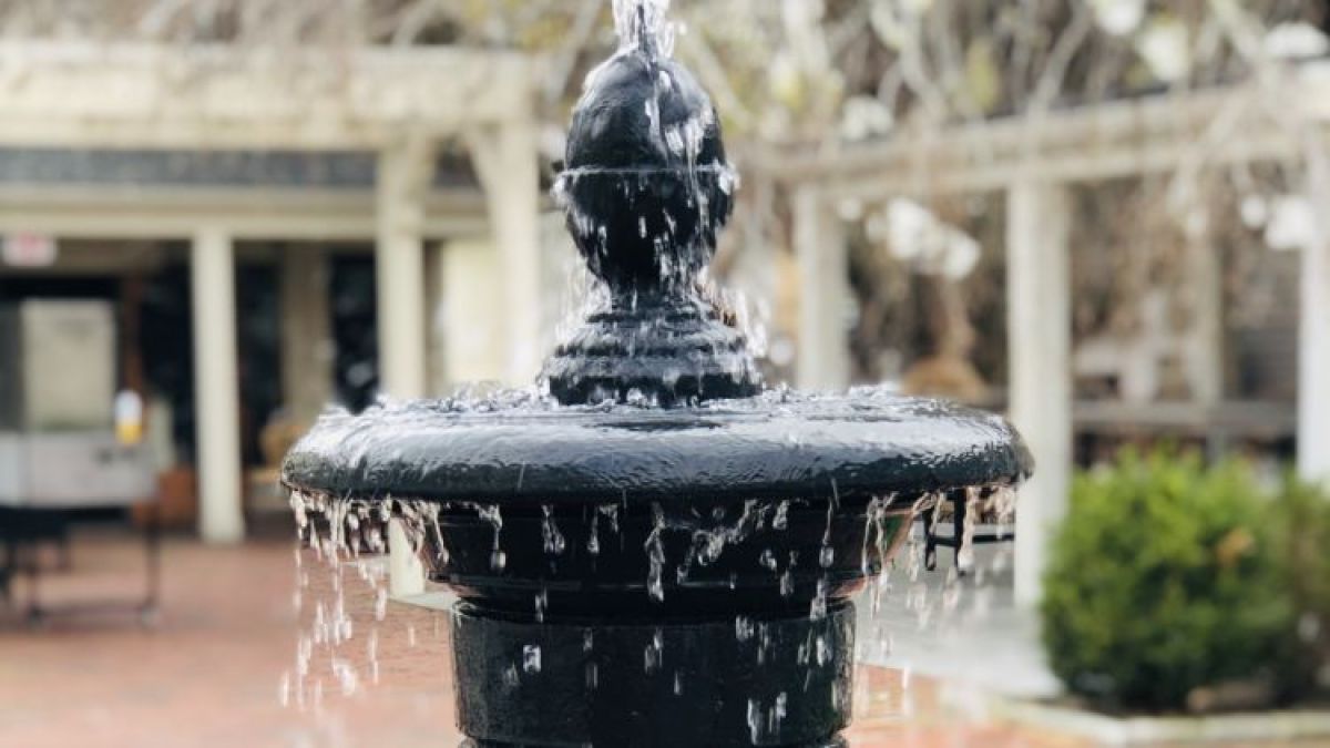 a fountain in front of a building