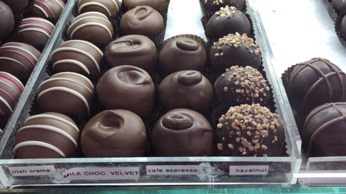 a box filled with different kinds of donuts