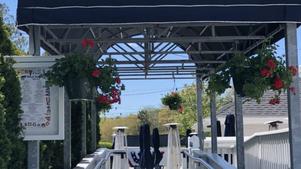 a group of people sitting at a train station