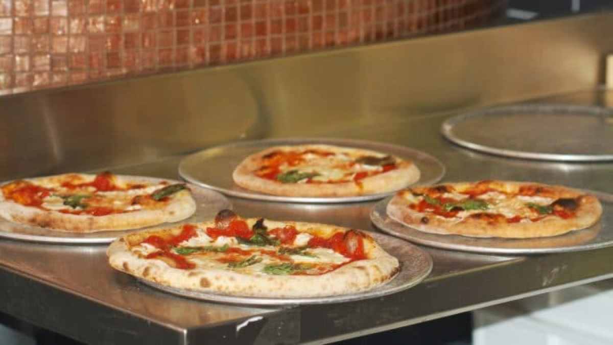 a pizza sitting on top of a counter