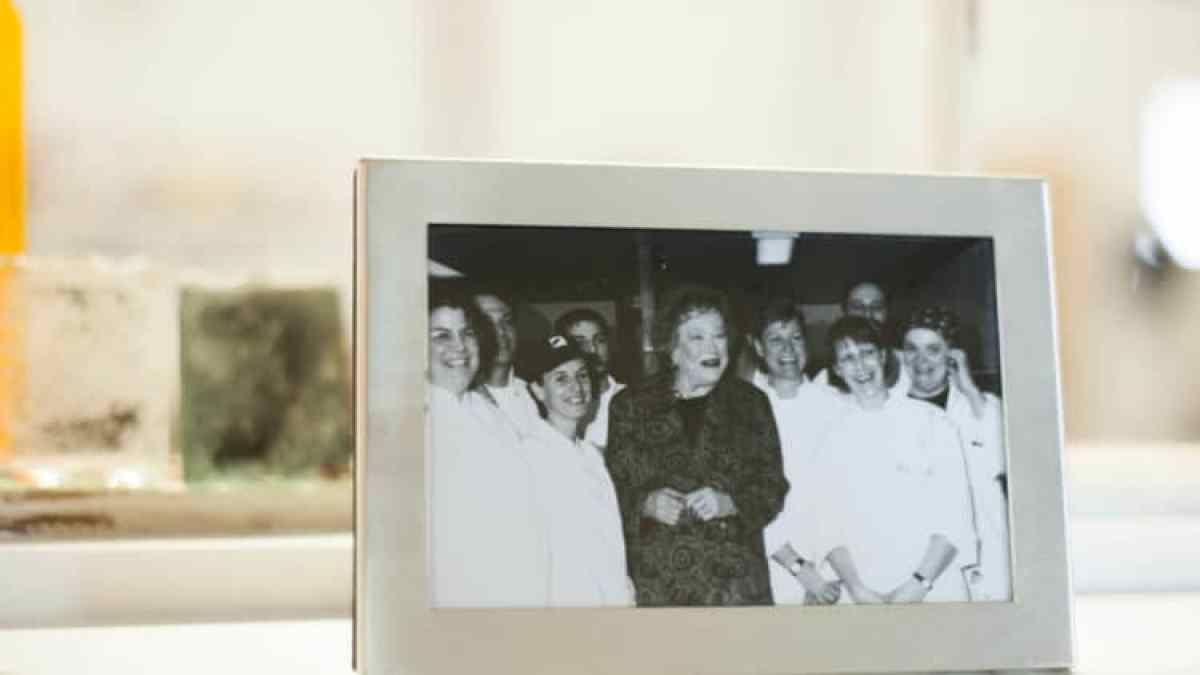 a person standing in front of a mirror posing for the camera